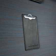 Load image into Gallery viewer, Close up to the contact information tag on the back panel. 
