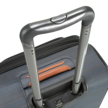 Load image into Gallery viewer, Angled top panel view of the suitcase with the handle extended. 
