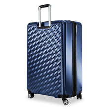 Load image into Gallery viewer, Angled back panel view of the blue hard shell suitcase. 
