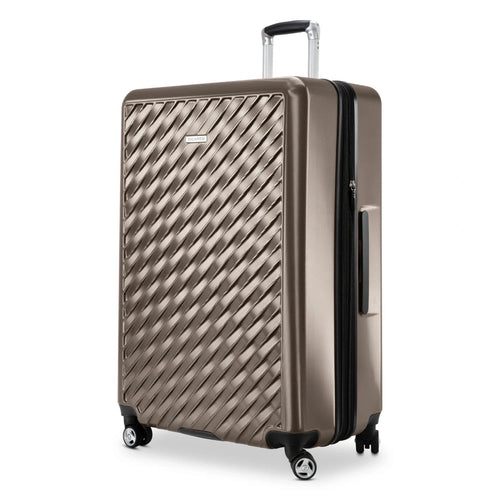 Angled front panel close up to the bronze hard shell suitcase. 