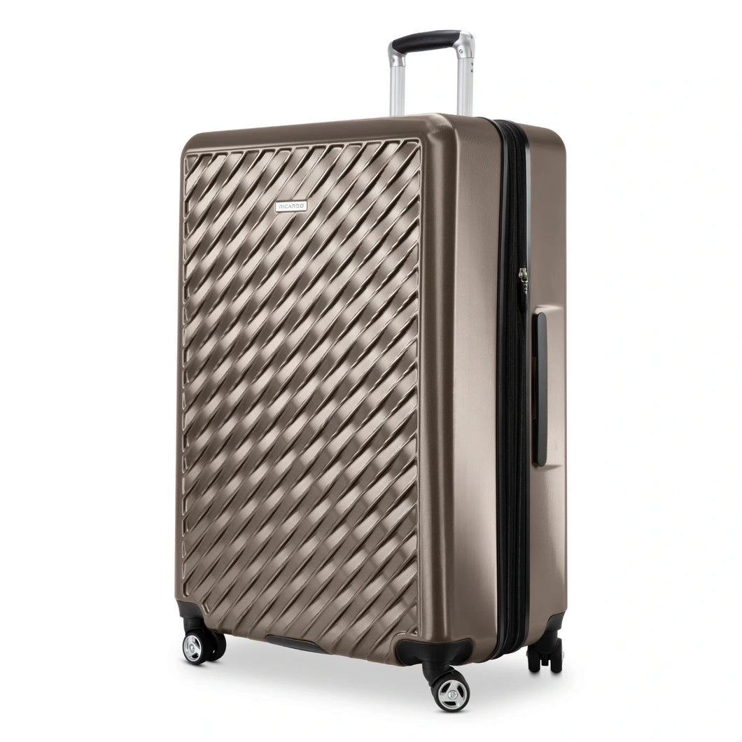 Angled front panel close up to the bronze hard shell suitcase. 