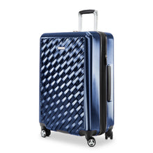 Load image into Gallery viewer, Angled front panel view of the blue had shell suitcase. 
