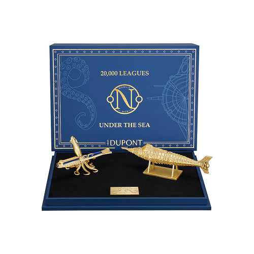 Gold submarine and squid pen holder in a '20,000 Leagues Under the Sea' Dupont display box.