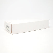 Load image into Gallery viewer, The white cardboard outer box on a light background.
