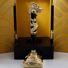 Load image into Gallery viewer, Side view of the pen on the stand. The presentation box stands opened behind it. 
