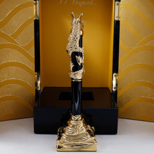 Load image into Gallery viewer, Back view of the pen on the stand. The presentation box stands opened behind it. 
