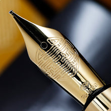 Load image into Gallery viewer, Close up to the golden nib with engraved decorations, a hallmark, 18k, M750
