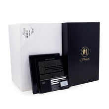 Load image into Gallery viewer, The documents, outside packaging and white dust sleeve arranged on a white background. 
