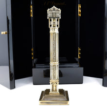 Load image into Gallery viewer, Front view of the fountain pen on its stand. The black lacquered presentation box stands behind it. 
