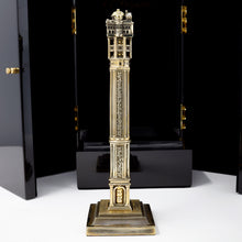 Load image into Gallery viewer, Side view of the fountain pen on the stand. The black lacquer presentation box stands behind it. 

