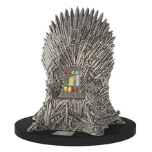 Load image into Gallery viewer, Angled view of the lighter set on its stand, which is designed after the iron throne of the series.
