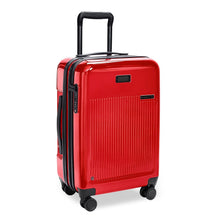Load image into Gallery viewer, Angled front view of the red carry on suitcase with black accents. The telescopic handle is pulled up. 
