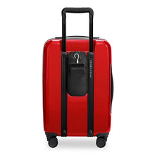 Load image into Gallery viewer, Back panel view of the red carry on suitcase with black accents. It features small bag to store your phone and battery bank between the handle rails. 
