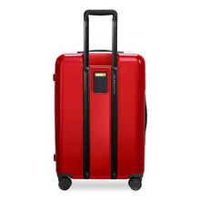 Load image into Gallery viewer, Back panel view of the red suitcase with black accents. It features a contact tag between the handle rails. 
