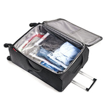 Load image into Gallery viewer, Interior view of a black suitcase with the clothes-filled compression bags arranged  inside.
