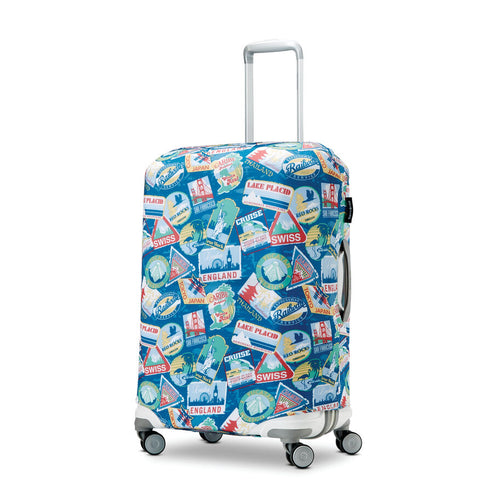 Angled front view of a medium suitcase with the blue cover. It features sticker designs of cities around the world. 