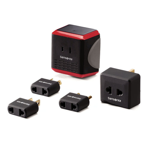 A set of five travel converters and adapters including a black and red Samsonite converter box with multiple black adapter plugs and a gold-toned connector.