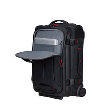 Load image into Gallery viewer, Angled front panel view, featuring the  opened front pocket holding a laptop in the padded compartment. 
