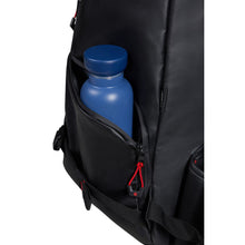 Load image into Gallery viewer, Close up to the side panel with a blue water bottle tucked inside. 
