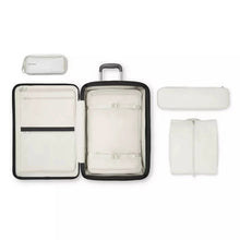 Load image into Gallery viewer, Interior view of the suitcase with a packing bag in the main compartment. The other bags are arranged around it. 
