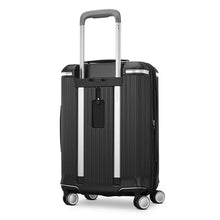 Load image into Gallery viewer, Angled back panel view of the black suitcase. 
