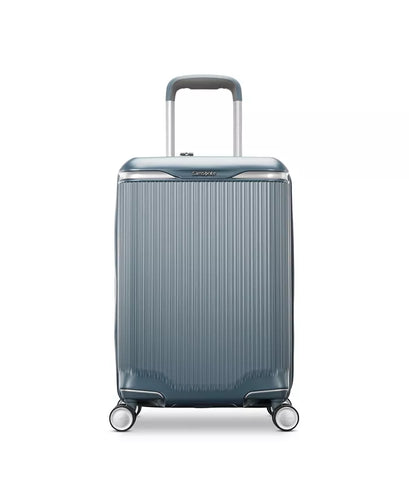 Front panel view of the slate blue suitcase. 