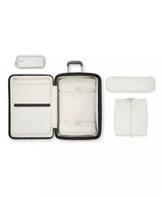 Load image into Gallery viewer, Interior view of the suitcase with the packing bag arranged inside. The other packing bags are arranged around it.

