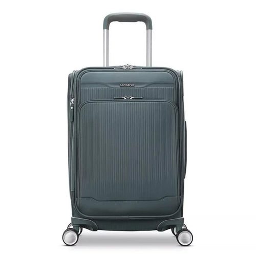 Front panel view of the slate blue suitcase. 