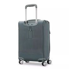 Load image into Gallery viewer, Angled back panel view of the slate blue suitcase.
