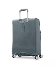Load image into Gallery viewer, Angled back panel view of the suitcase. An ID tag is available under the handle. 
