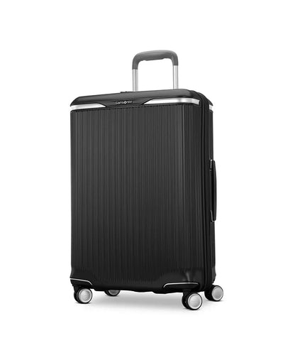 Angled front panel view of the black suitcase. 