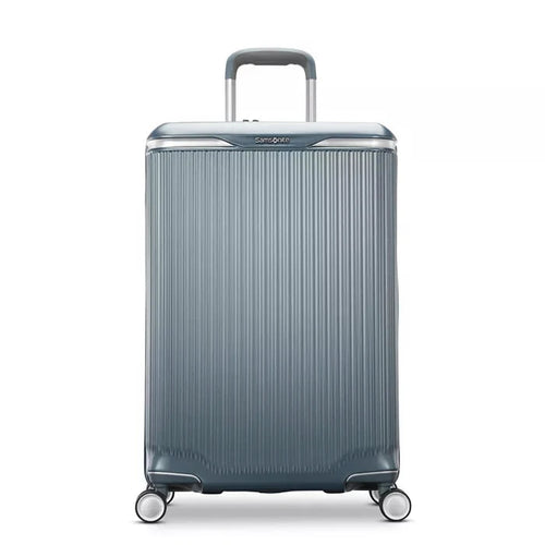 Front panel view of the slate blue suitcase. 