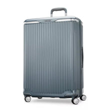 Load image into Gallery viewer, Angled front panel view of the blue slate suitcase.

