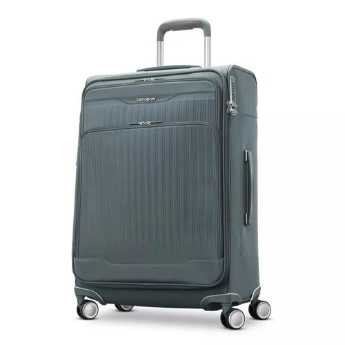 Angled front panel view of the slate blue suitcase. 