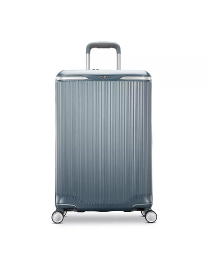 Front panel view of the slate blue suitcase. 