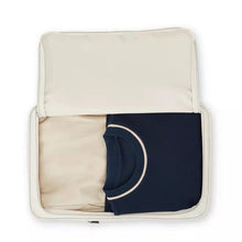 Load image into Gallery viewer, Interior view of the packing bag with clothes folded inside. 
