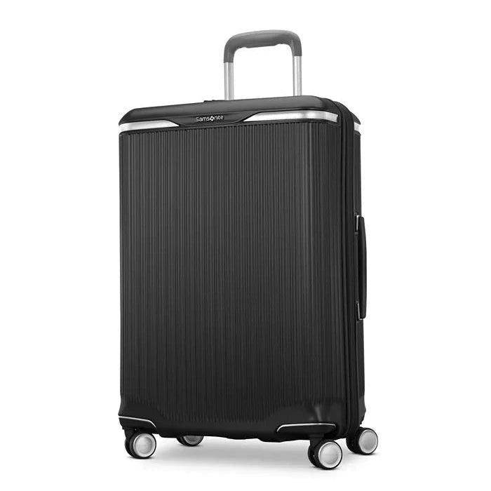 Angled front panel view of the black suitcase. 