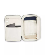 Load image into Gallery viewer, Interior view of the backpack with accessories arranged in the compartments. 
