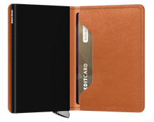 Load image into Gallery viewer, Interior view of the Basco Slim Cognac wallet. The aluminum card case on the left side is black.
