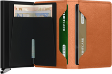 Load image into Gallery viewer, Interior view of the Basco Slim Wallet in Cognac. The back of the aluminum case has a money clip, and a pocket for credit cards. 
