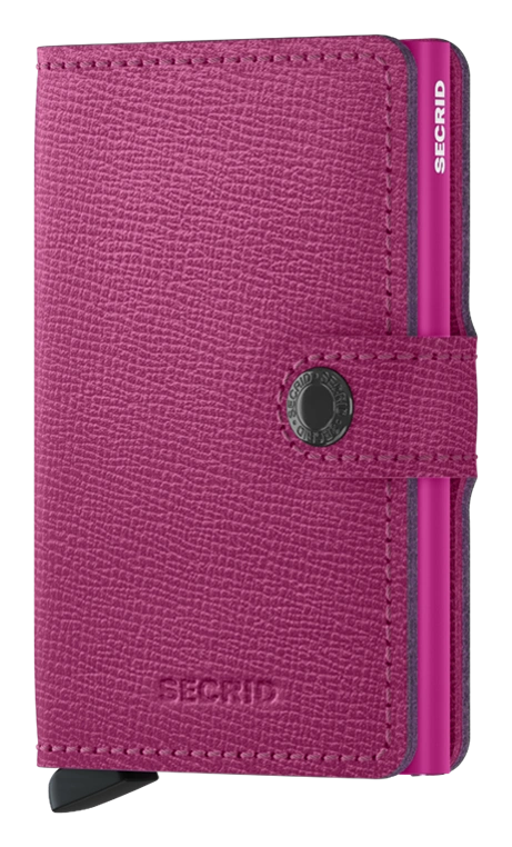 Angled front view of the fuchsia mini wallet. It features a button closing strap. 
