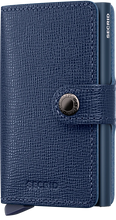 Load image into Gallery viewer, Angled front view of the navy blue mini wallet. A button closing strap is featured. 
