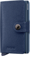 Angled front view of the navy blue mini wallet. A button closing strap is featured. 