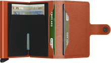 Load image into Gallery viewer, Interior view of the pumpkin wallet. The back of the card case features a money clip. 
