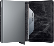 Load image into Gallery viewer, Interior view of the dark grey slim wallet. The aluminum card case is light gray. 
