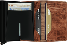 Load image into Gallery viewer, Interior view of the whiskey slim wallet. The back of the aluminum card case features a bill clip. 
