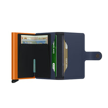 Load image into Gallery viewer, Interior view, unfolded. There is cash in the money clip and credit cards in the pockets.
