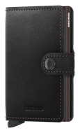 Angled front view of the black and brown mini wallet. It features a button closing strap. 