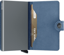 Load image into Gallery viewer, Interior view of the ice blue mini wallet. The aluminum card case is light gray. 
