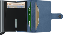 Load image into Gallery viewer, Interior view of the ice blue mini wallet. The back of the aluminum card case features a money clip. 
